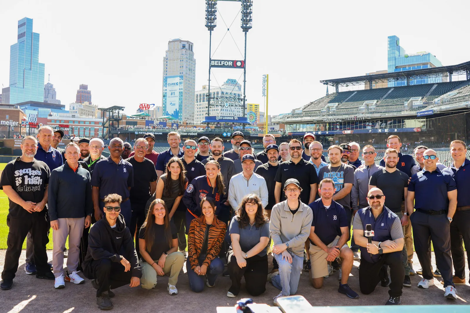 The Detroit Tigers broadcast and media crew gathered on the field at Comerica Park