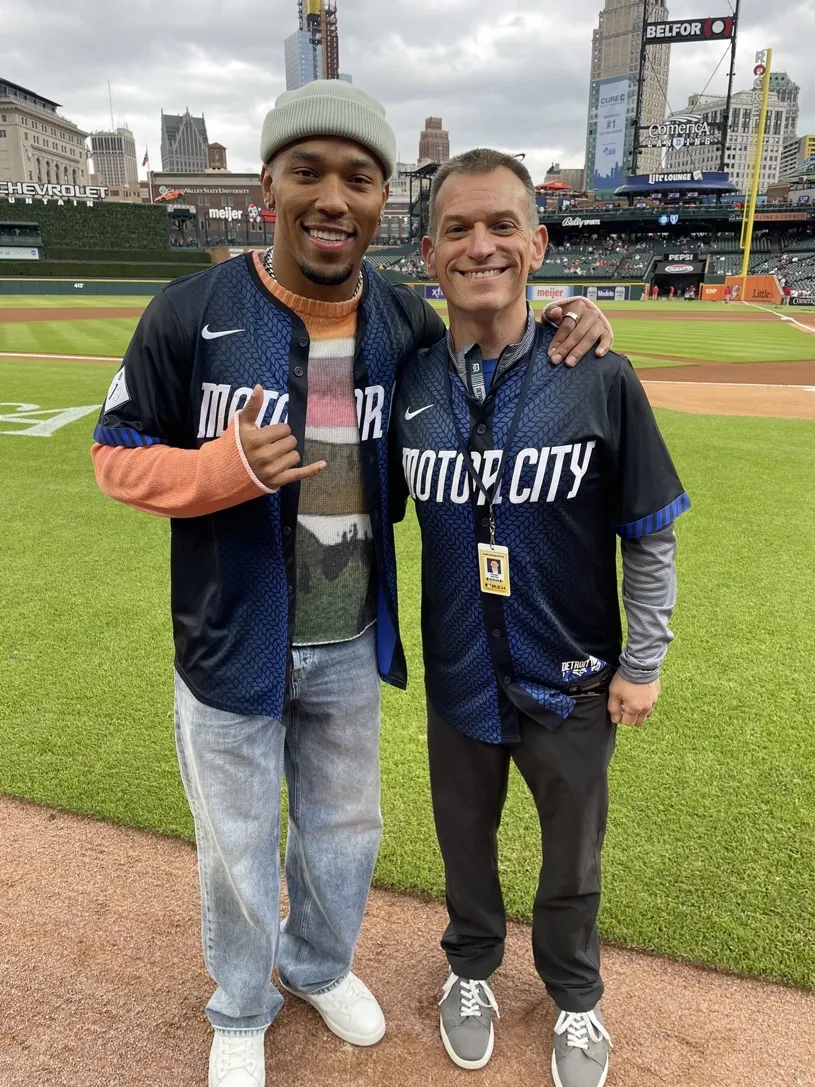 Greg Gania on the field at Comerica Park in a Detroit Motor City jersey